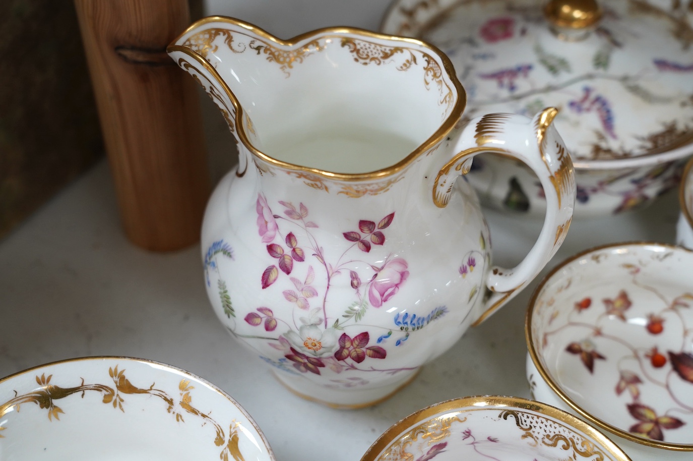 A floral part tea and coffee set, probably Swansea, c.1815-20, largest 23.5cm diameter. Condition - mostly fair